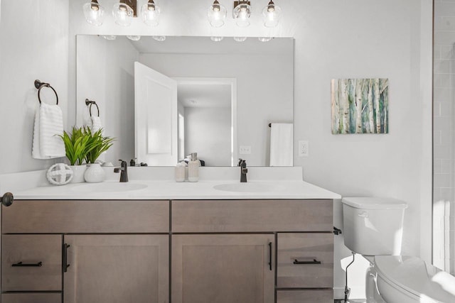 bathroom featuring toilet and vanity