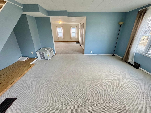 interior space featuring light colored carpet