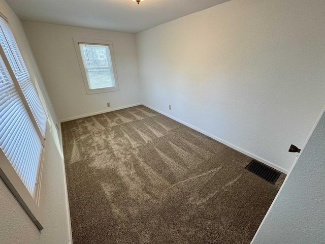 empty room featuring carpet floors