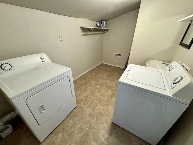 laundry area with washing machine and clothes dryer