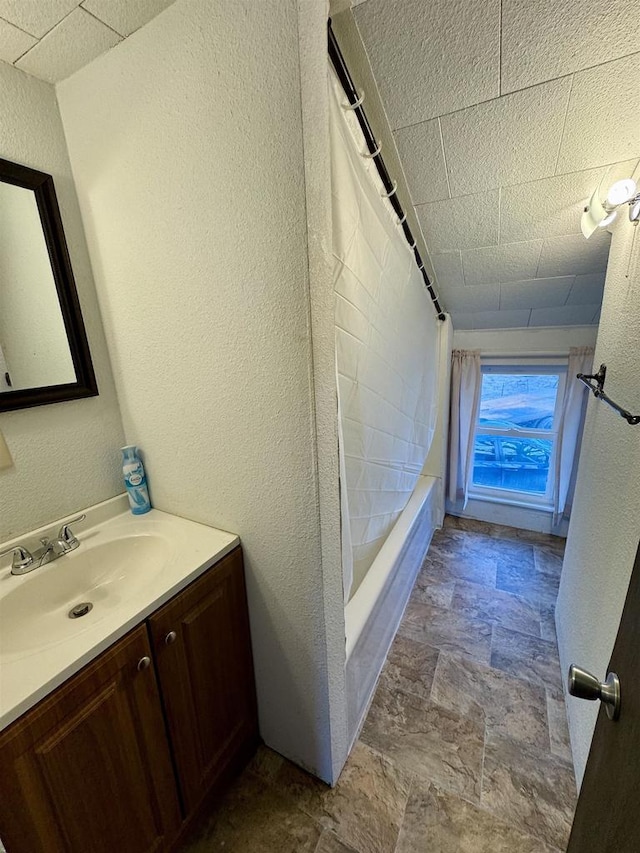 bathroom featuring shower / bath combination and vanity