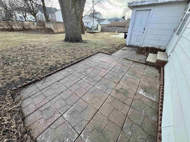 view of patio / terrace with a storage unit