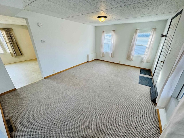 spare room with radiator and carpet floors