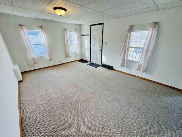 unfurnished bedroom featuring carpet floors and multiple windows