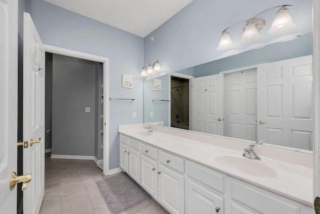 bathroom with shower / bathtub combination, tile patterned floors, and vanity