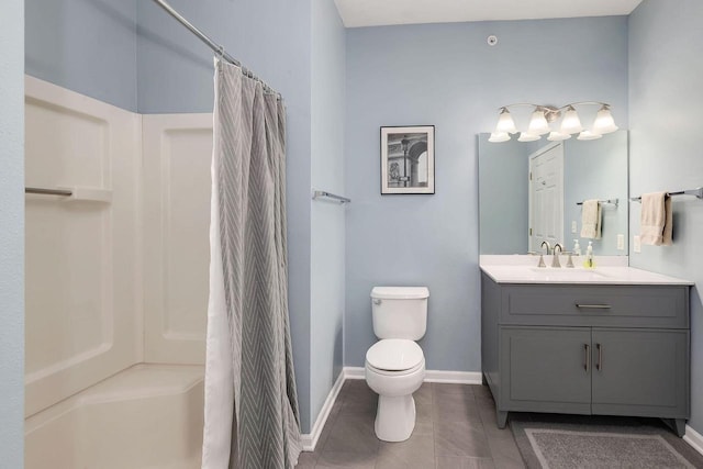 bathroom featuring toilet, vanity, a shower with curtain, and tile patterned flooring