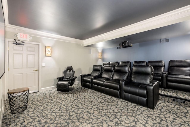 cinema featuring ornamental molding and carpet flooring