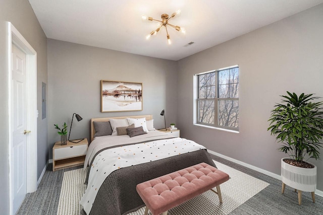 bedroom featuring carpet floors and a notable chandelier