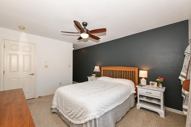 bedroom with ceiling fan and light colored carpet