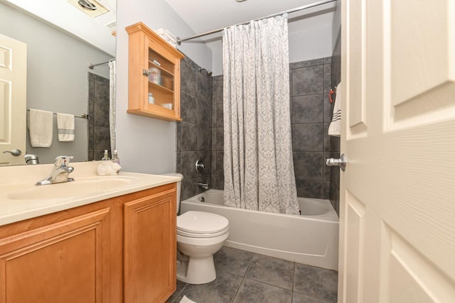 full bathroom featuring toilet, shower / bath combo, vanity, and tile patterned floors