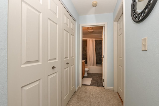 hallway with light tile patterned floors