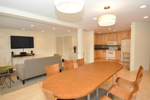 dining room with light wood-type flooring