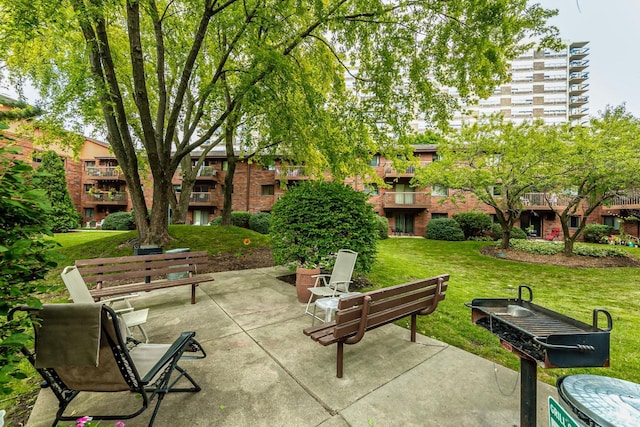 surrounding community featuring a patio area and a yard