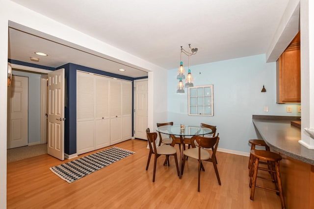 dining area featuring light wood-type flooring