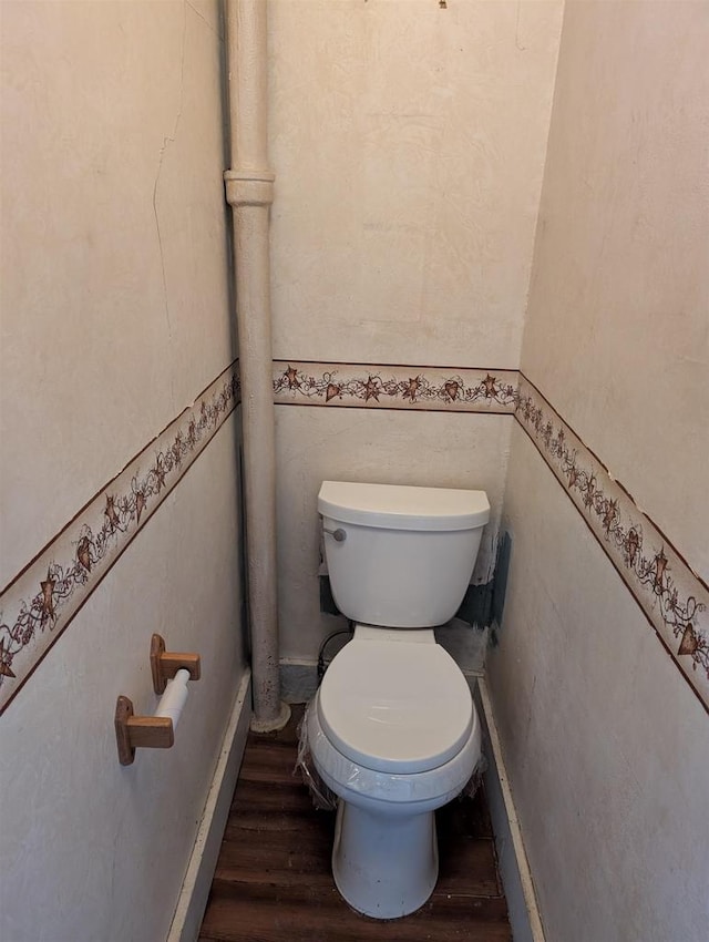 bathroom with toilet and wood-type flooring