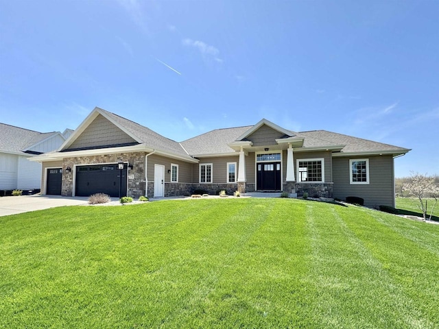 view of front facade featuring a front lawn and a garage