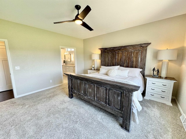 carpeted bedroom featuring ceiling fan and connected bathroom