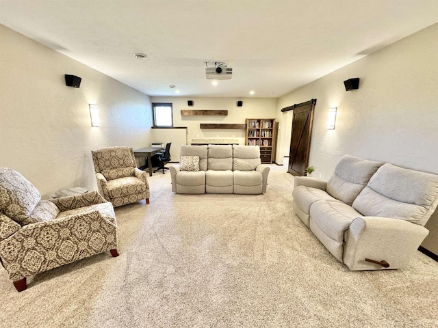 carpeted living room with a barn door