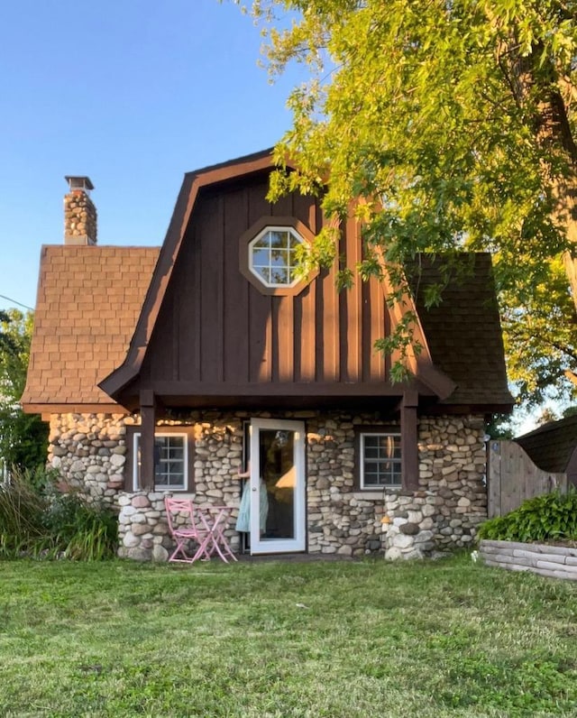 rear view of house with a lawn