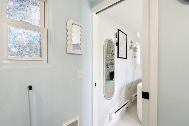 bathroom with a baseboard radiator and tile patterned floors