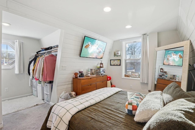 bedroom with lofted ceiling and carpet floors