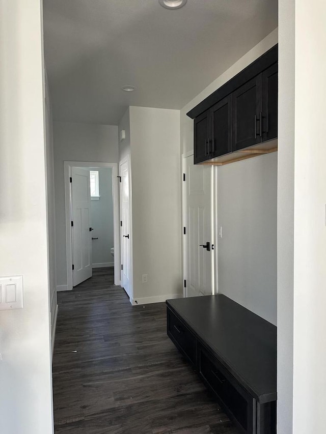 corridor featuring dark hardwood / wood-style floors