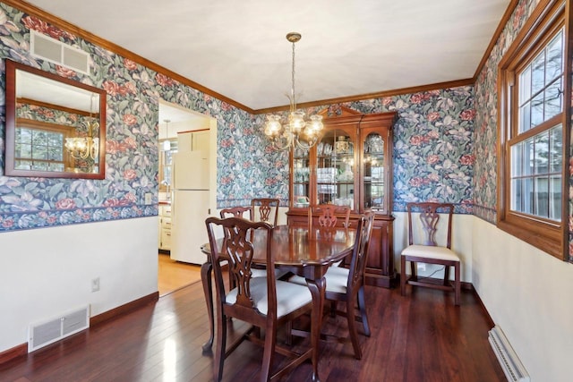 dining room featuring a notable chandelier, dark wood-type flooring, crown molding, and a baseboard radiator