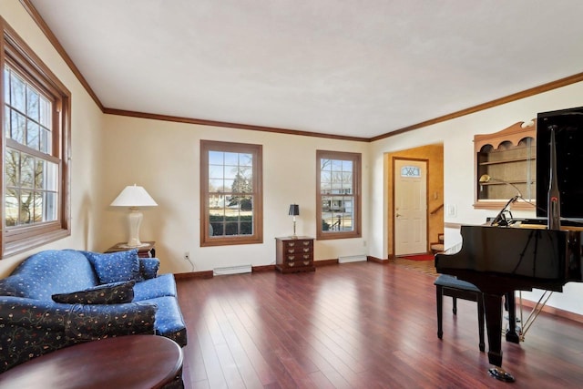 living area with baseboard heating, crown molding, and dark hardwood / wood-style floors