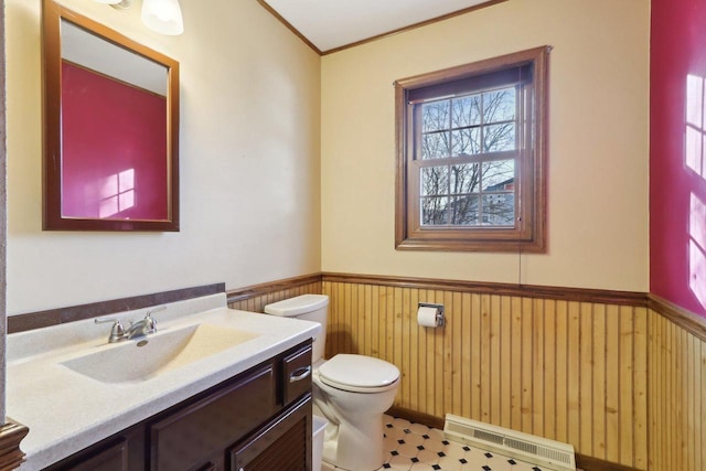 bathroom with toilet, vanity, and tile patterned flooring