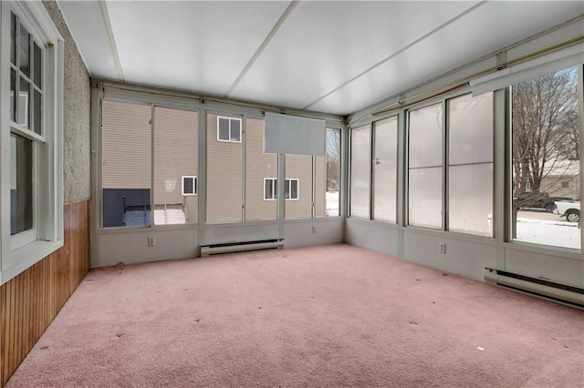 unfurnished sunroom featuring a baseboard heating unit