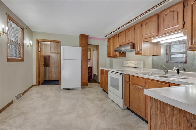 kitchen featuring sink and white appliances