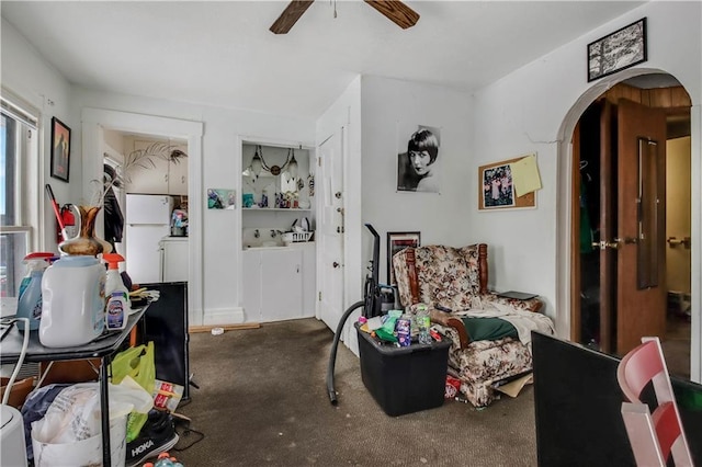 living area with ceiling fan