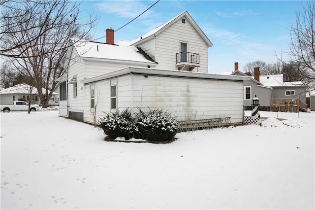 view of snow covered house