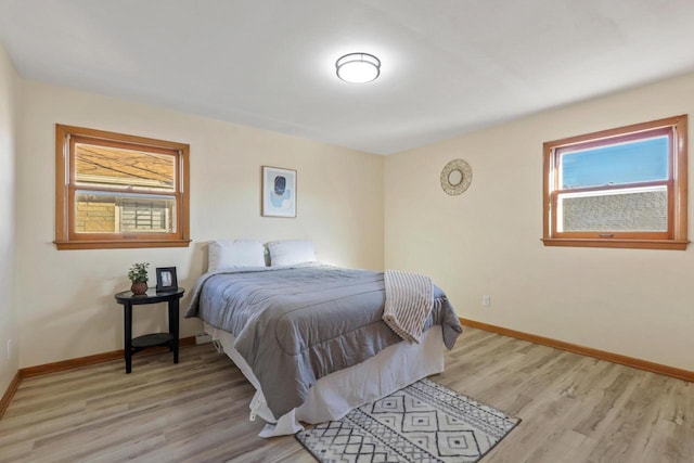 bedroom with light wood-type flooring