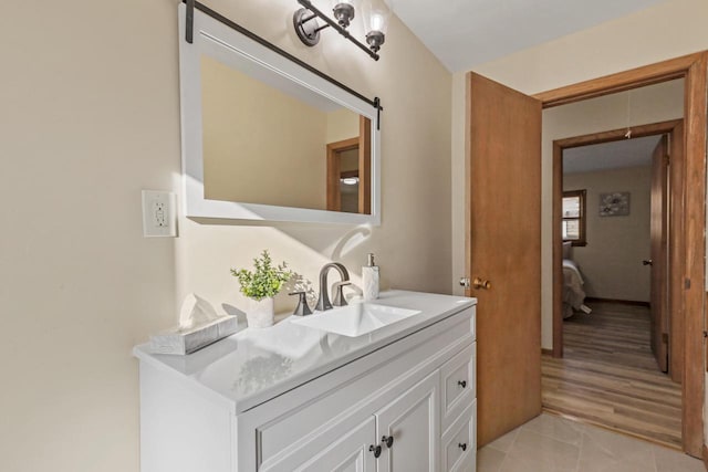 bathroom with tile patterned flooring and vanity