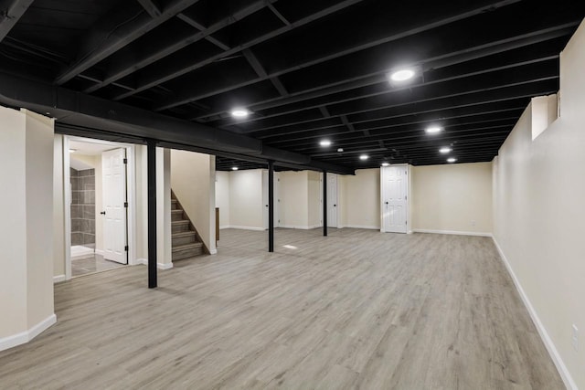 basement with wood-type flooring