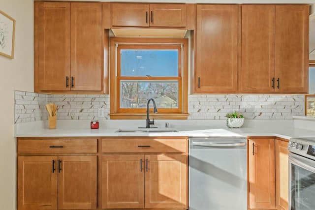 kitchen featuring appliances with stainless steel finishes, backsplash, and sink