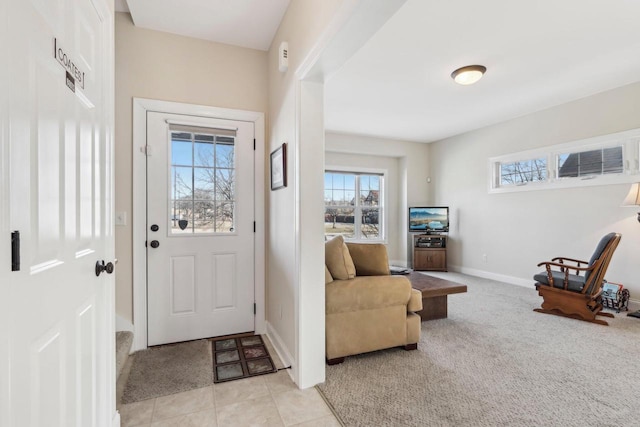 foyer entrance with light colored carpet