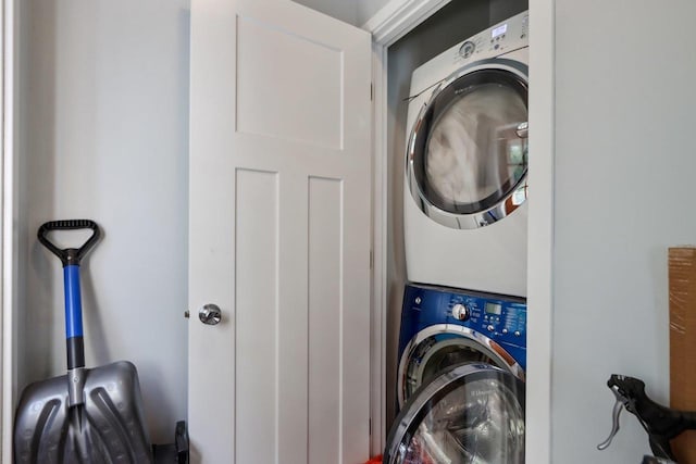 laundry area with stacked washing maching and dryer