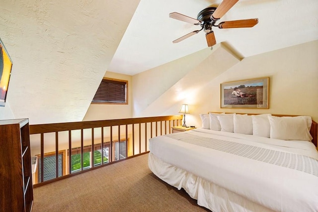 bedroom featuring vaulted ceiling, ceiling fan, and carpet flooring