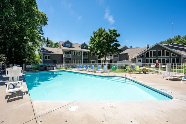 view of swimming pool featuring a patio area