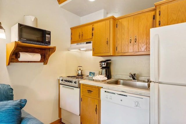 kitchen with sink and white appliances