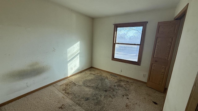 view of carpeted spare room