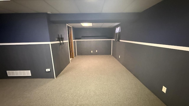 basement featuring light colored carpet