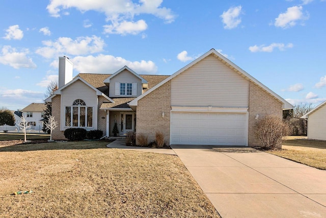 view of front property with a garage and a front yard