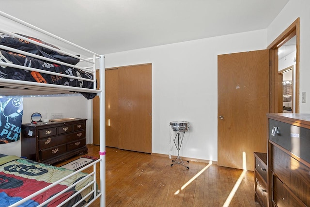 bedroom featuring hardwood / wood-style flooring and a closet