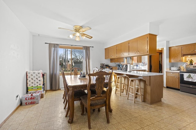 dining space featuring ceiling fan