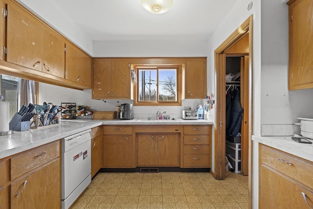 kitchen with white dishwasher and sink