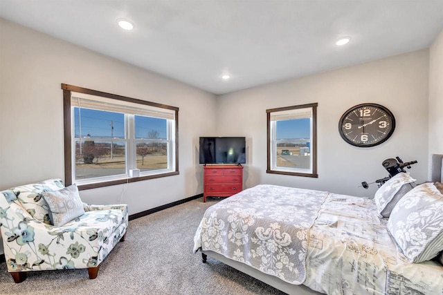 bedroom with carpet flooring and multiple windows