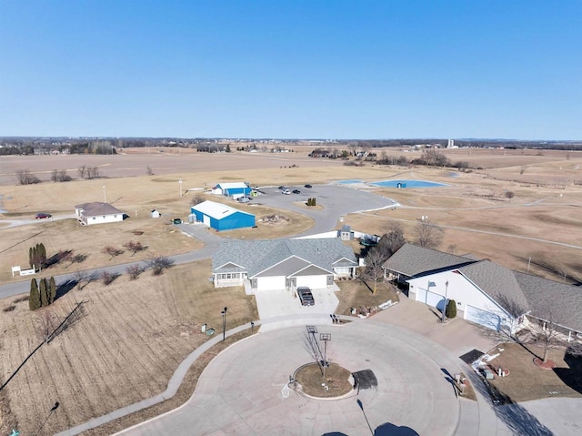 birds eye view of property with a rural view